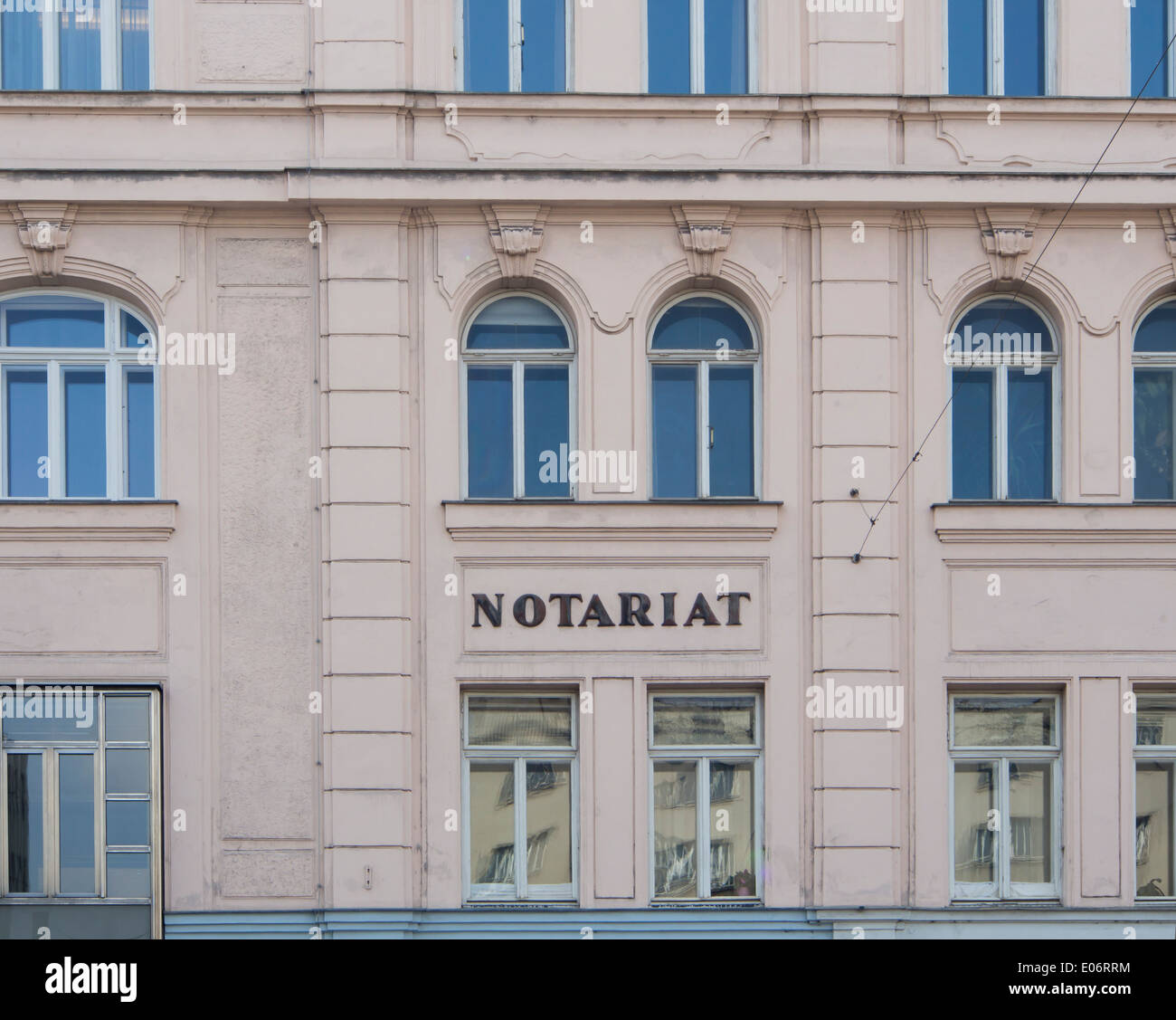 section of pink house facade with the word Notariat in center, Vienna Austria Stock Photo