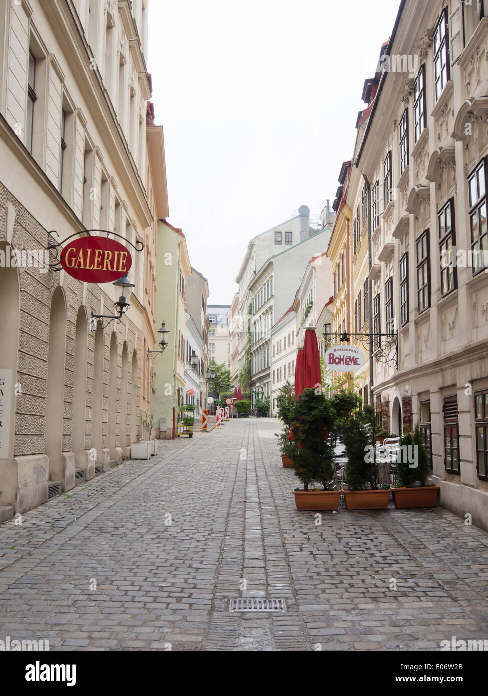 Narrow cobbled street with old house facades, gallery and restaurant, Spittelberg Neubau Vienna Austria Stock Photo