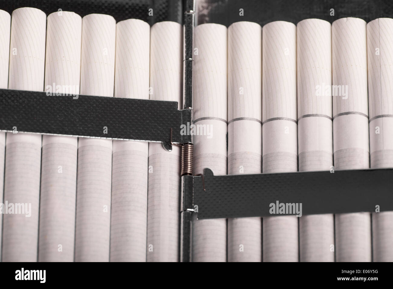 Color detail of a cigarette case with white cigarettes. Stock Photo