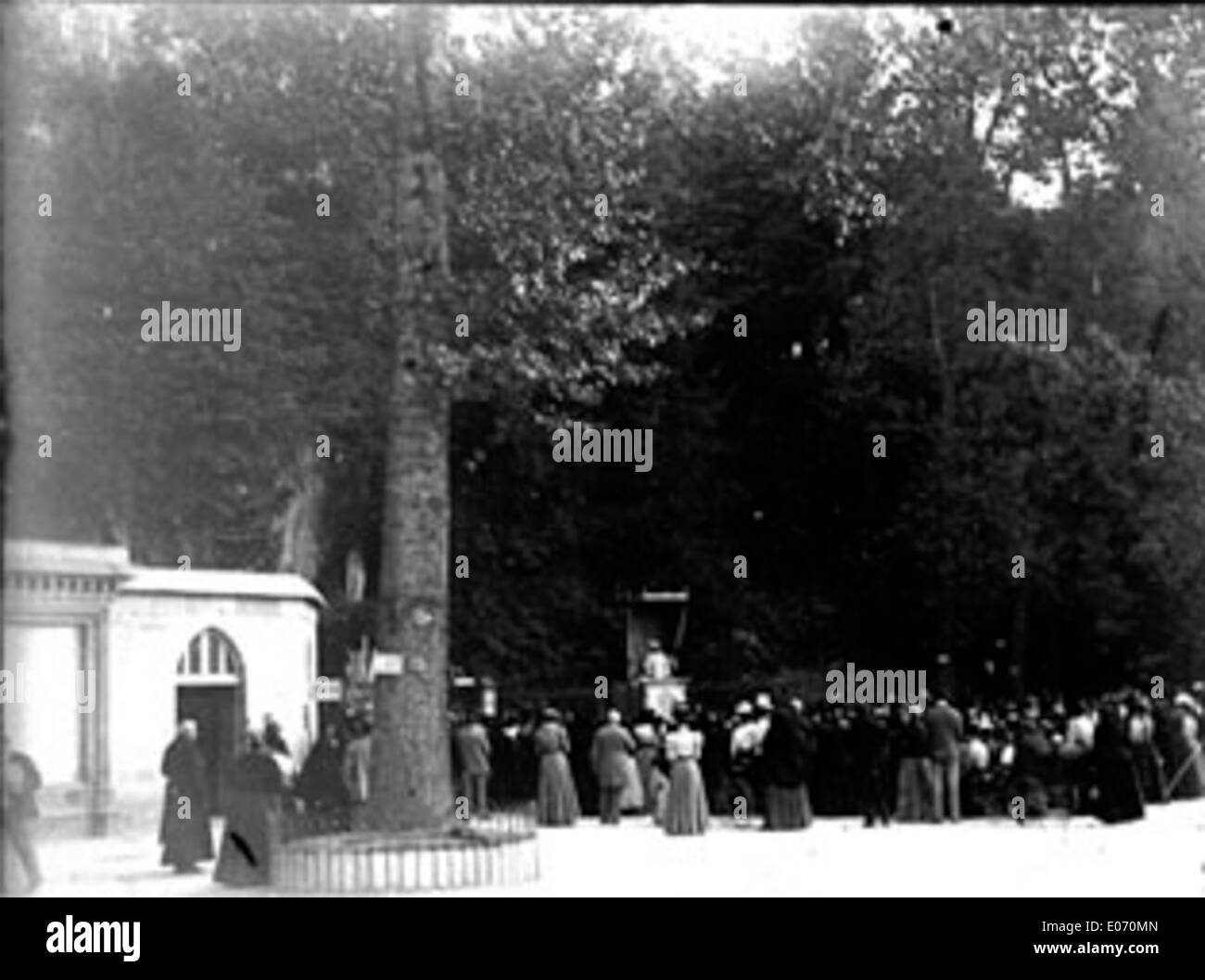 A photograph of the Belgian pilgrimage to the Grotto of Lourdes on August 27, 1898. The image shows pilgrims gathered at the religious site in the French town of Lourdes, known for its spiritual significance. Stock Photo