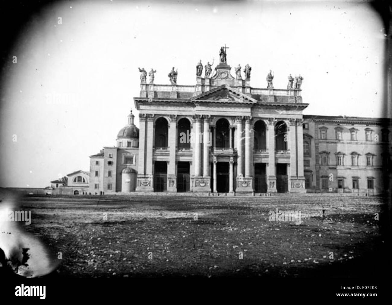 This panoramic view shows the Archbasilica of St. John Lateran in Rome, one of the oldest and most important churches in the city. The basilica is a major religious site and the cathedral of the Diocese of Rome. Stock Photo