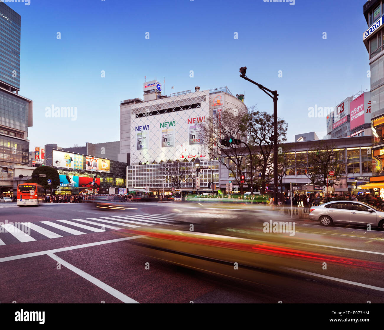 Blurred taxi cab in front of Tokyu building and Shibuya station in Tokyo, Japan Stock Photo