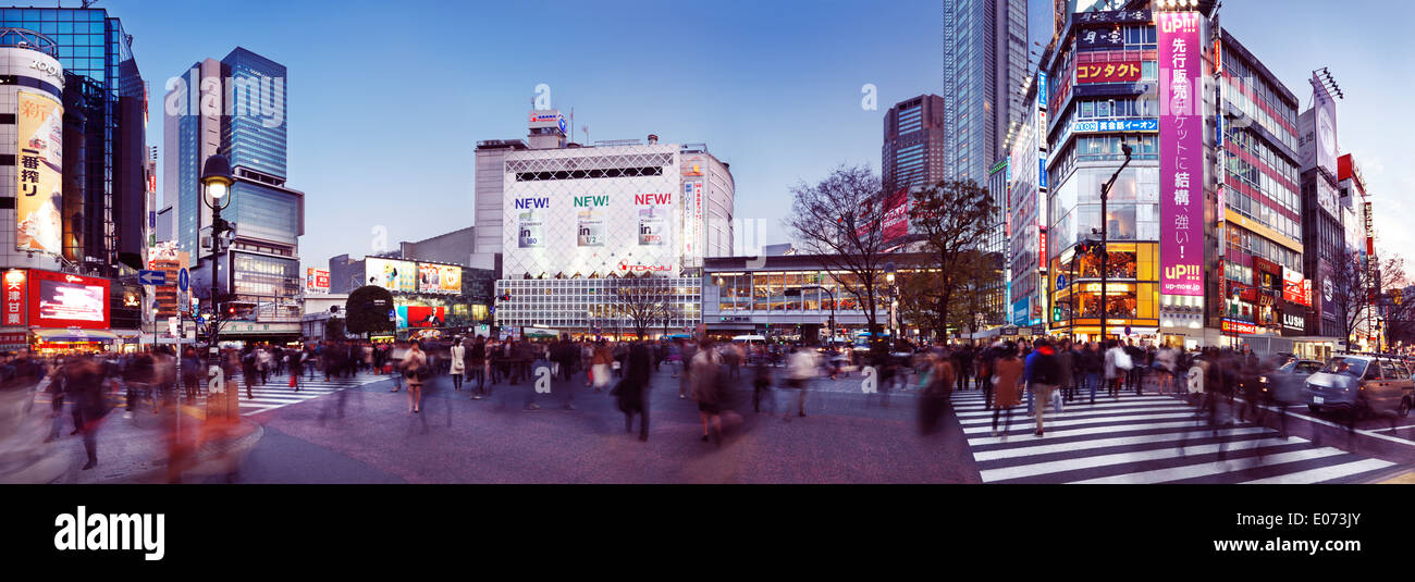 License available at MaximImages.com - People on a busy crowded intersection in front of Shibuya station in Tokyo, Japan. Panoramic city scenery. Stock Photo