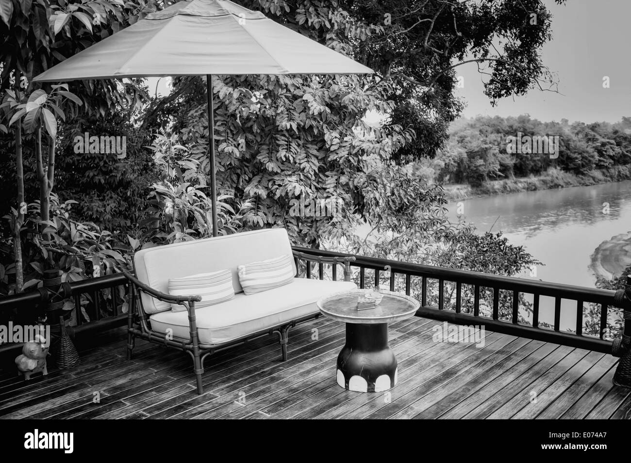black and white armchairs and river view on the Terrace Stock Photo