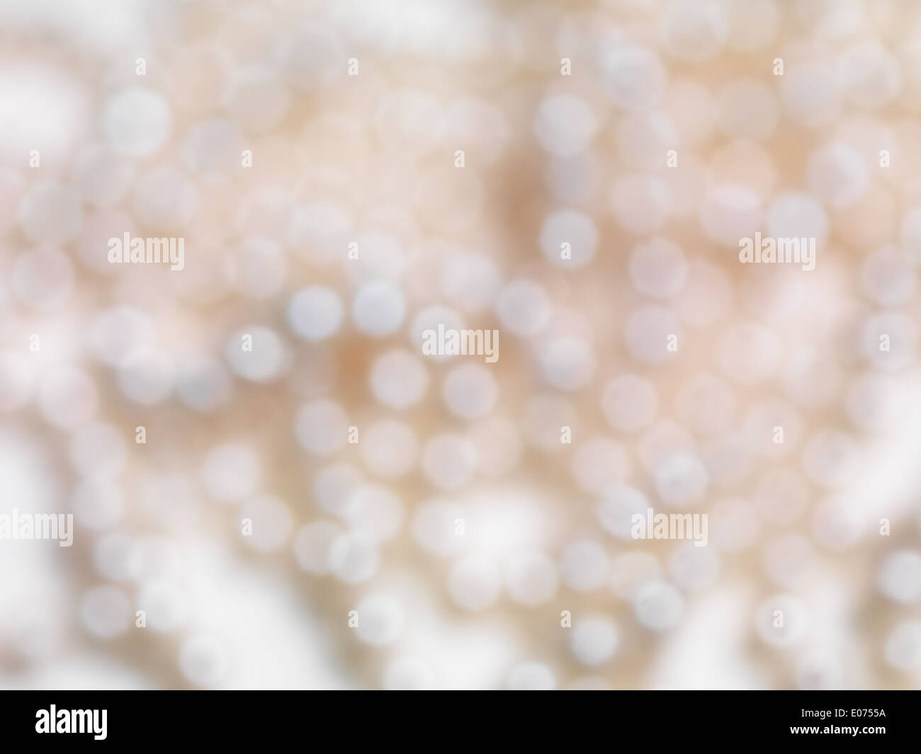 Abstract beige shiny blurred out of focus background texture Stock Photo