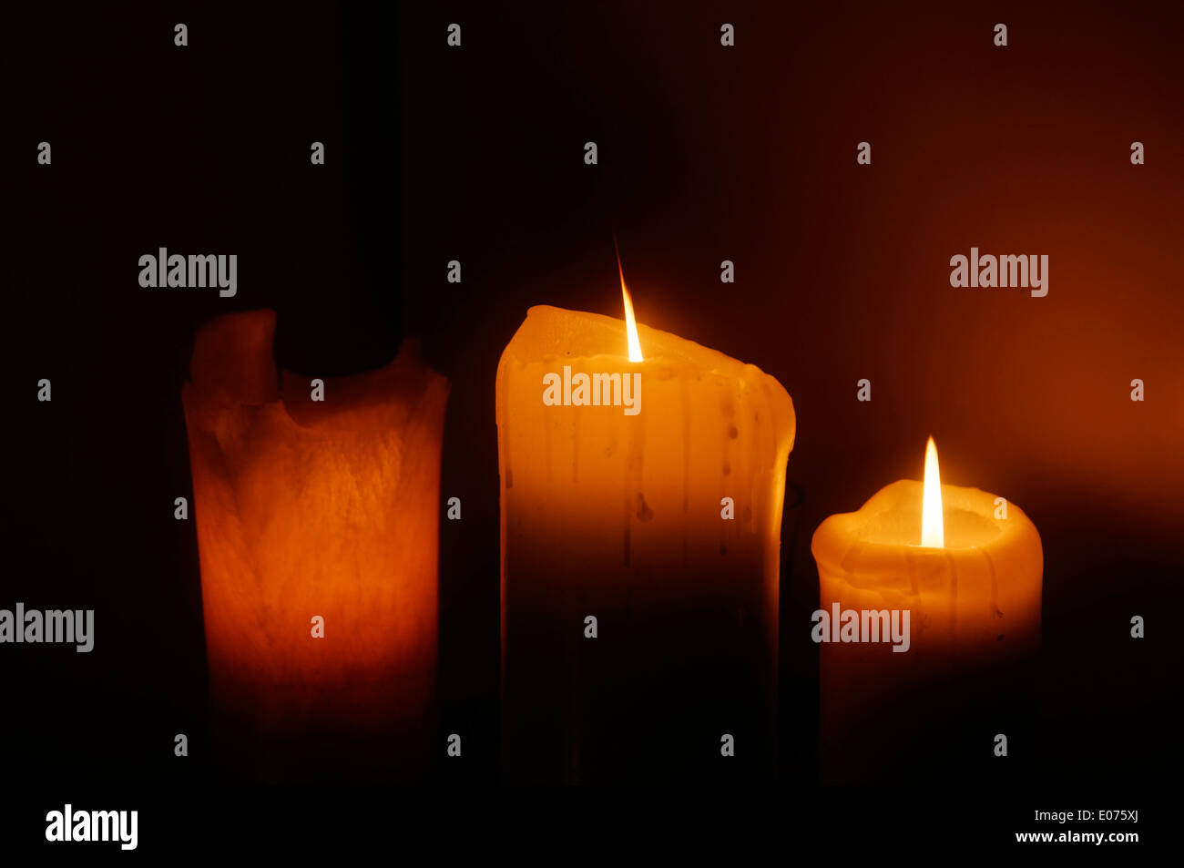 Three candles burning Stock Photo