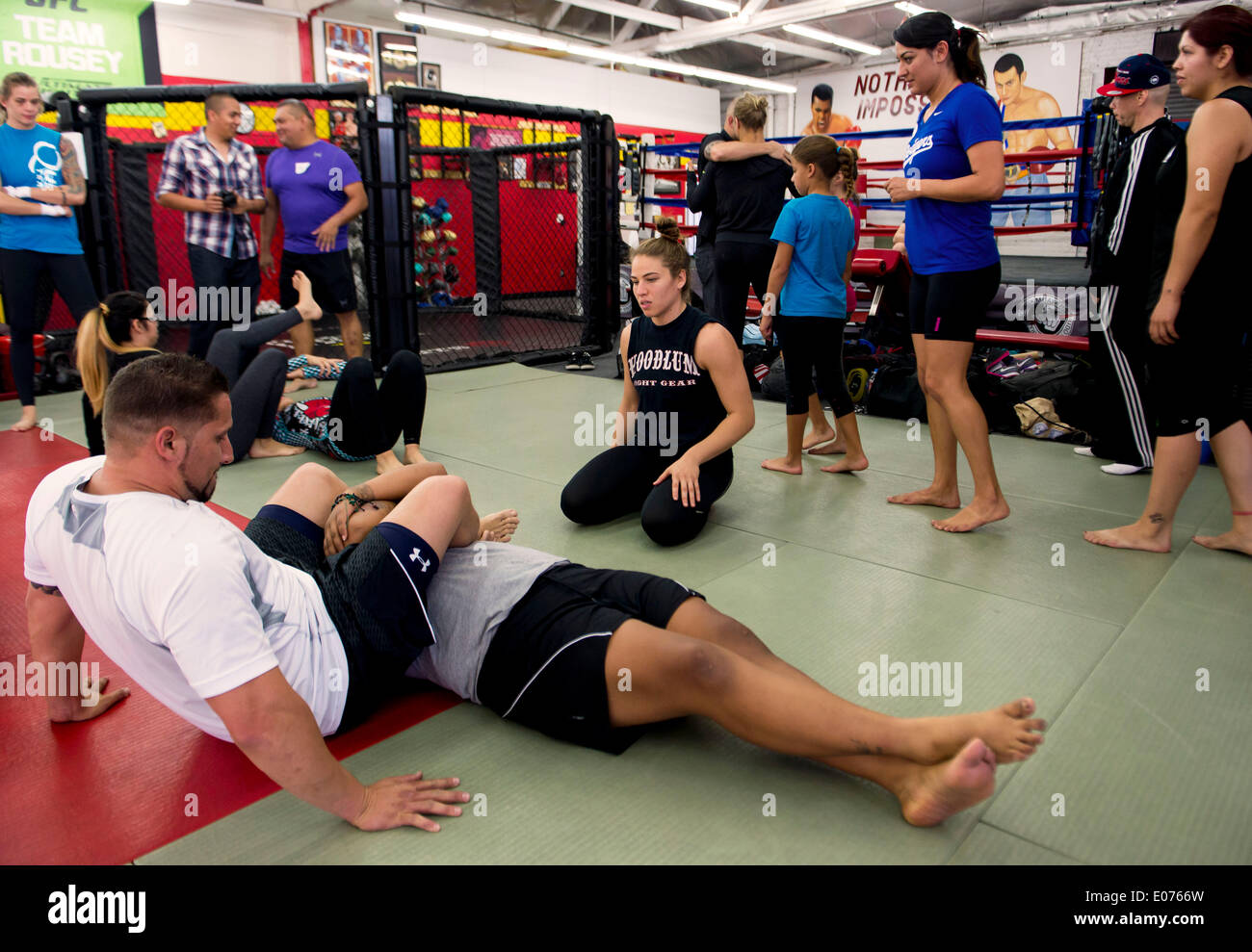 Glendale, California, USA. 04th May, 2014. MARINA SHAFIR, kneeling, teaches  fight techniques during a clinic at her training facility, the Glendale  Fight Club. The three-hour clinic was put on by the MMA