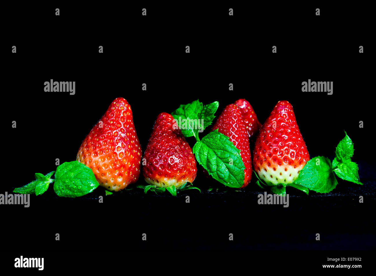 Strawberries isolated on black background Stock Photo - Alamy