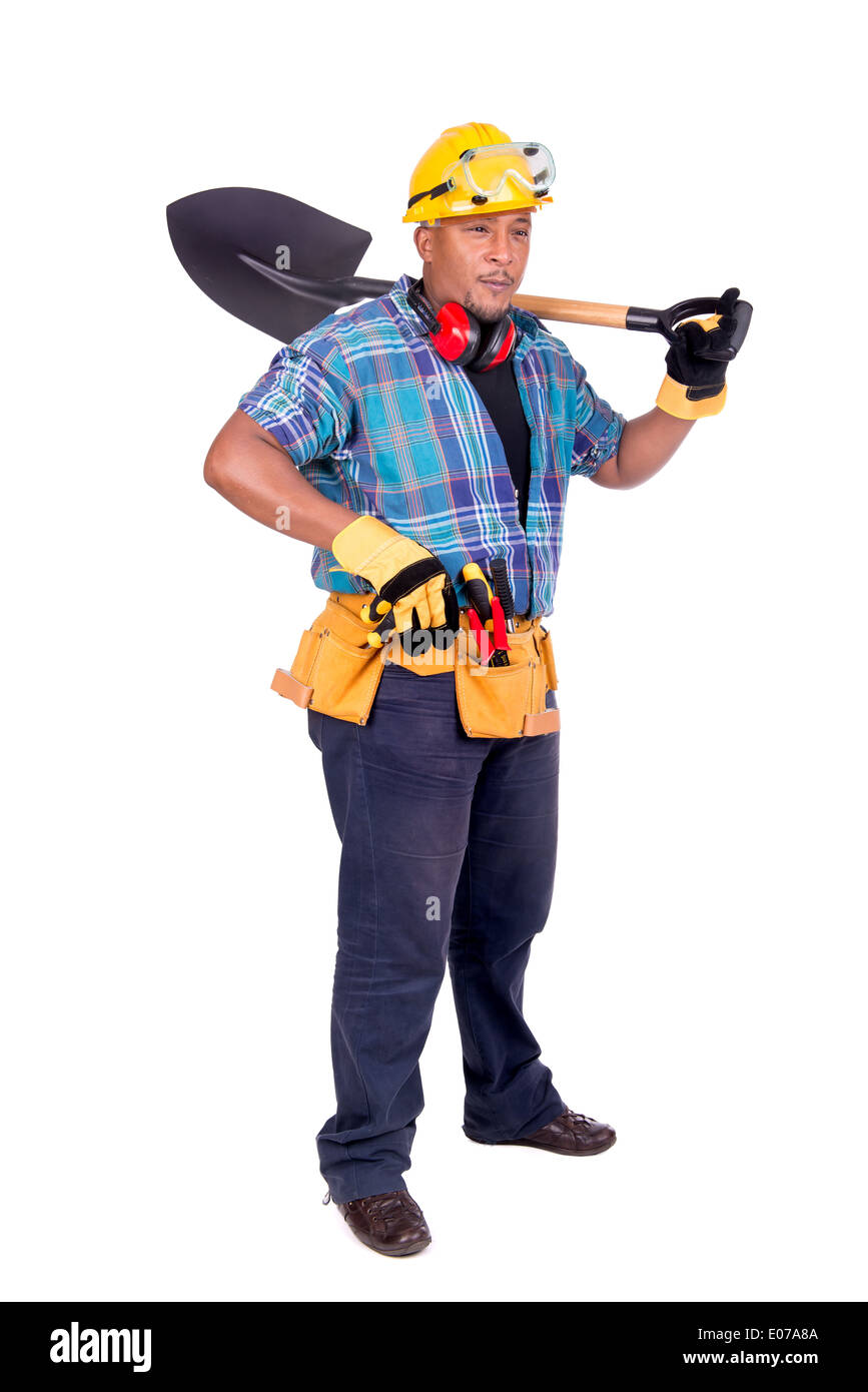 Two workers in hard hats, work clothes and a medical mask work with shovels  at a construction site. Hard physical labor. An authentic scene at work  Stock Photo - Alamy