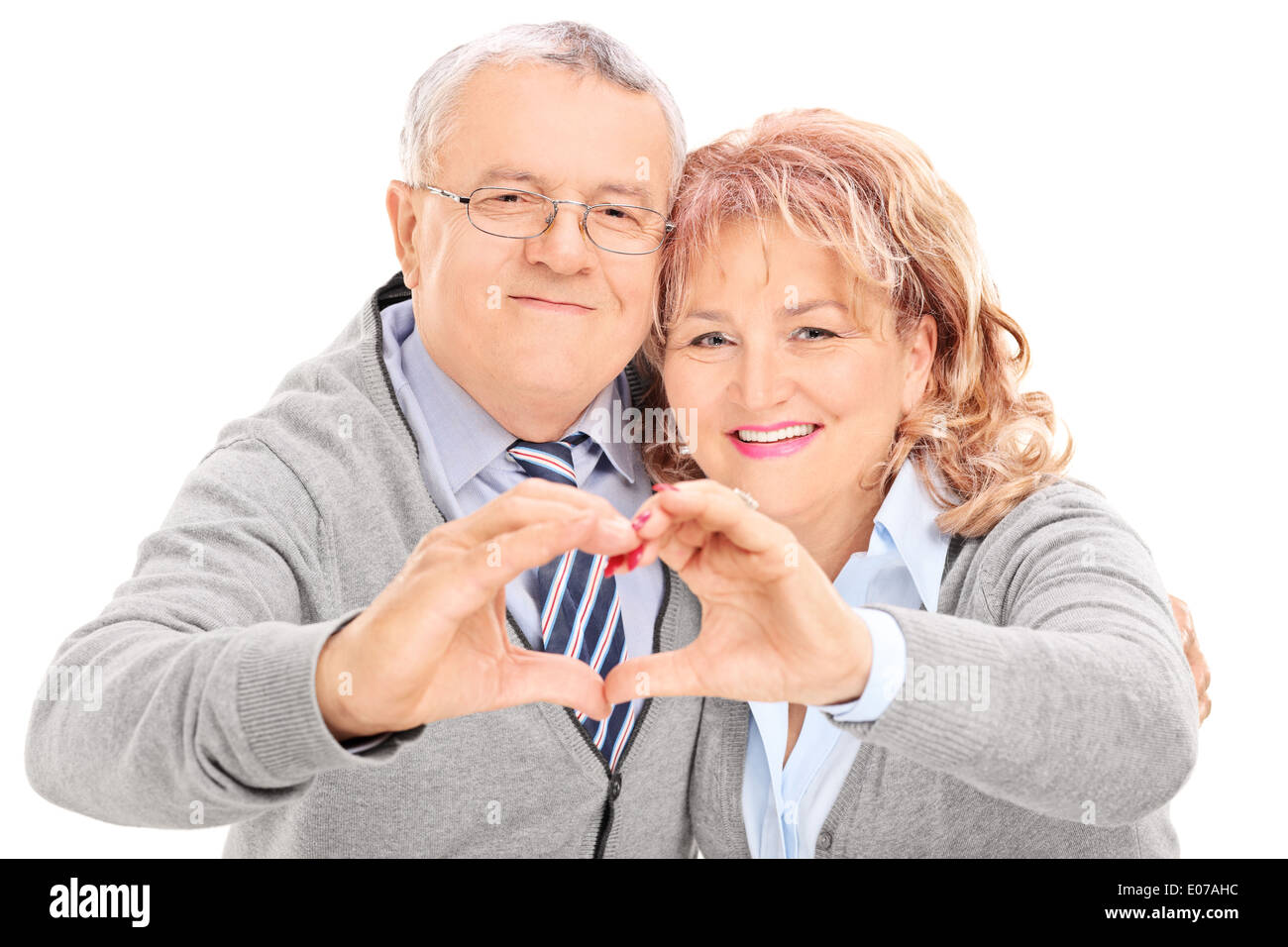 Mature couple making heart with their hands Stock Photo - Alamy