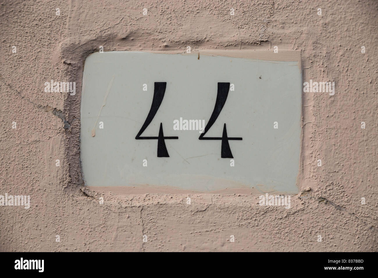 Door number on a wall Stock Photo Alamy