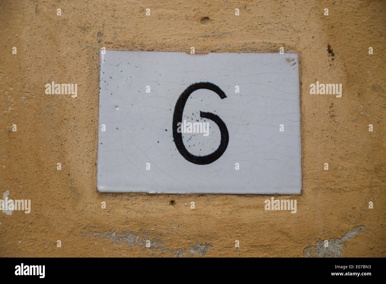 Door number on a wall Stock Photo Alamy