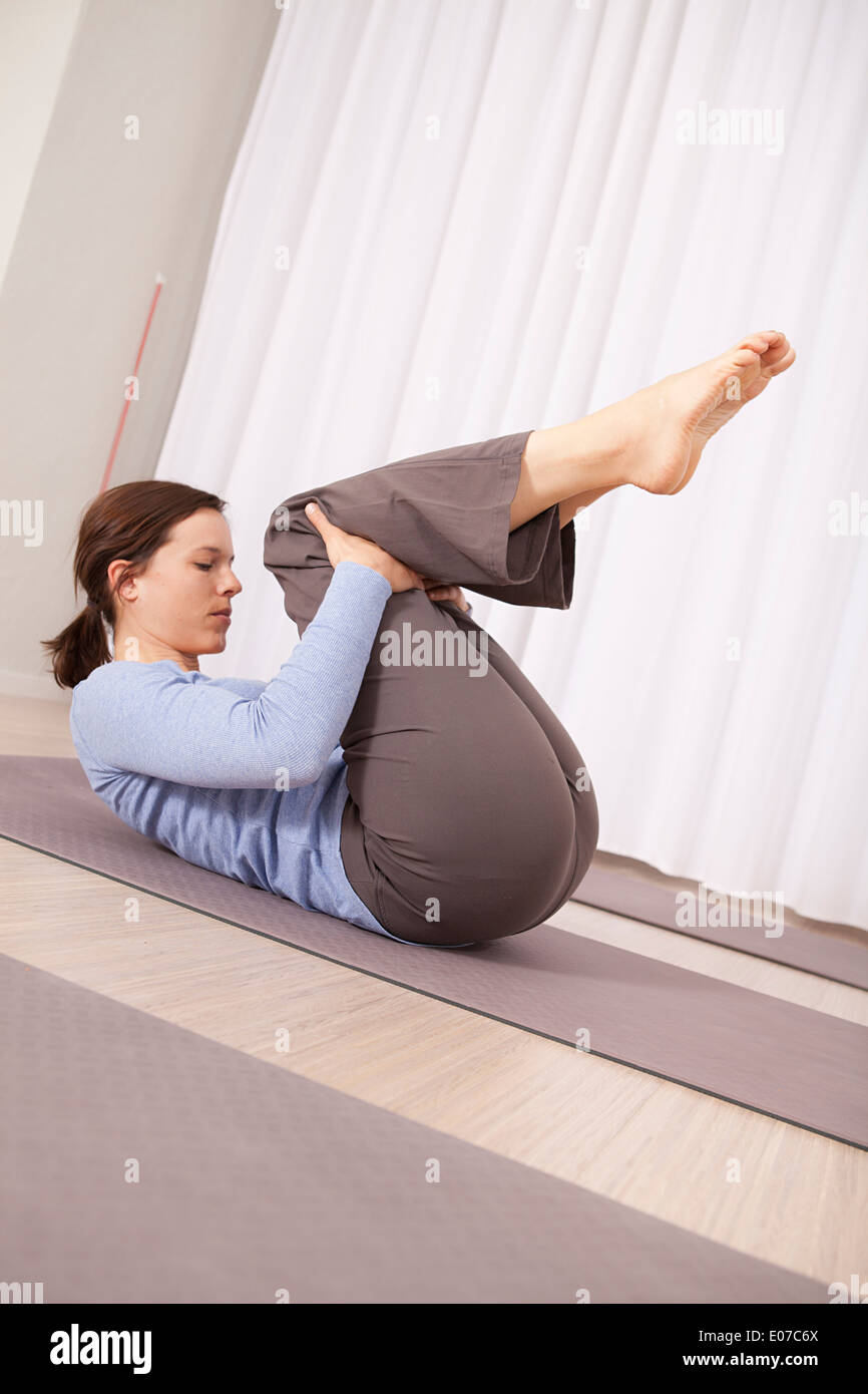 One woman lying on back feet up hires stock photography and images Alamy