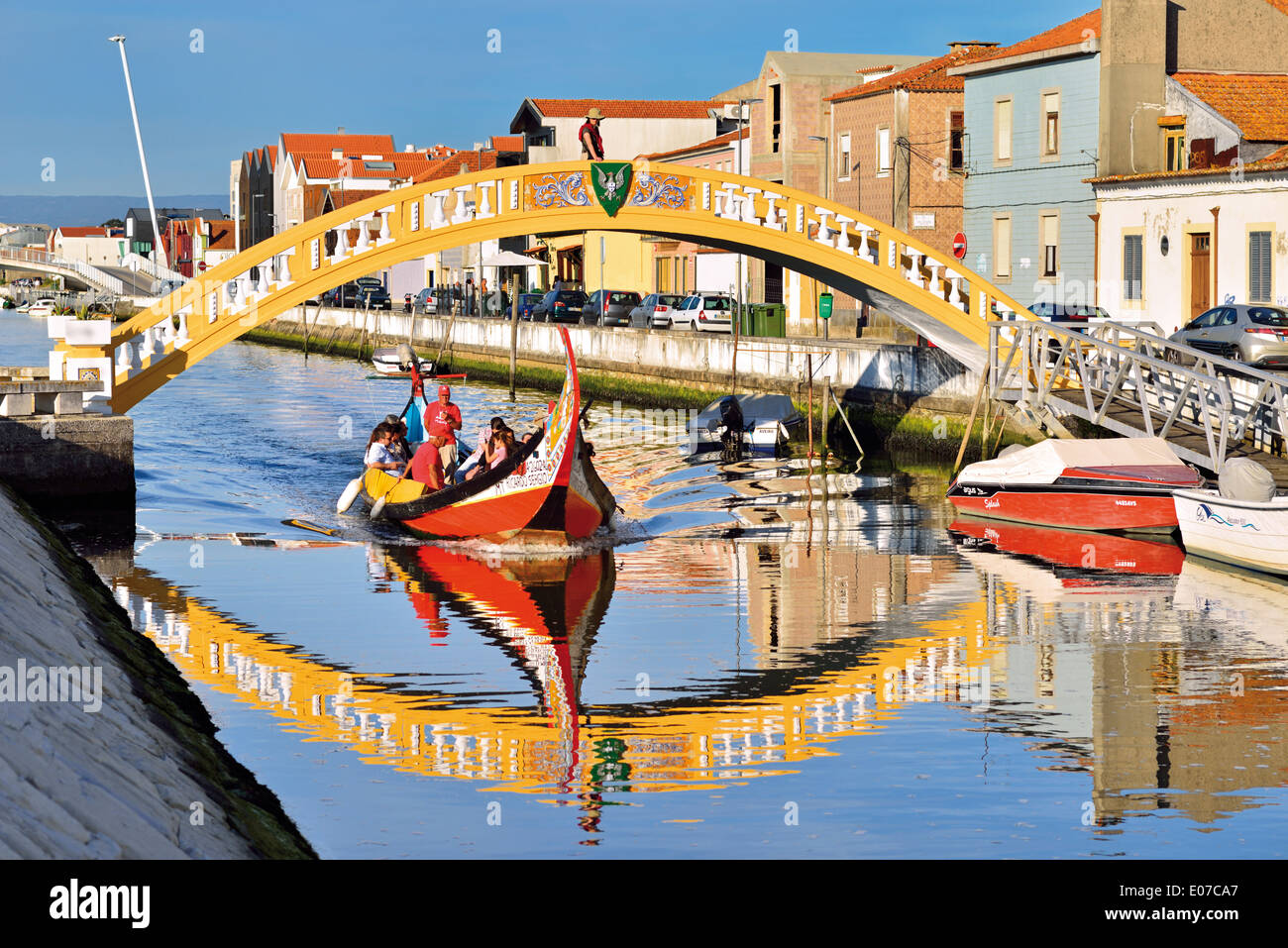 Portugal, Aveiro: Traditional Moliceiro boat crossing the channel of Sao Roque Stock Photo