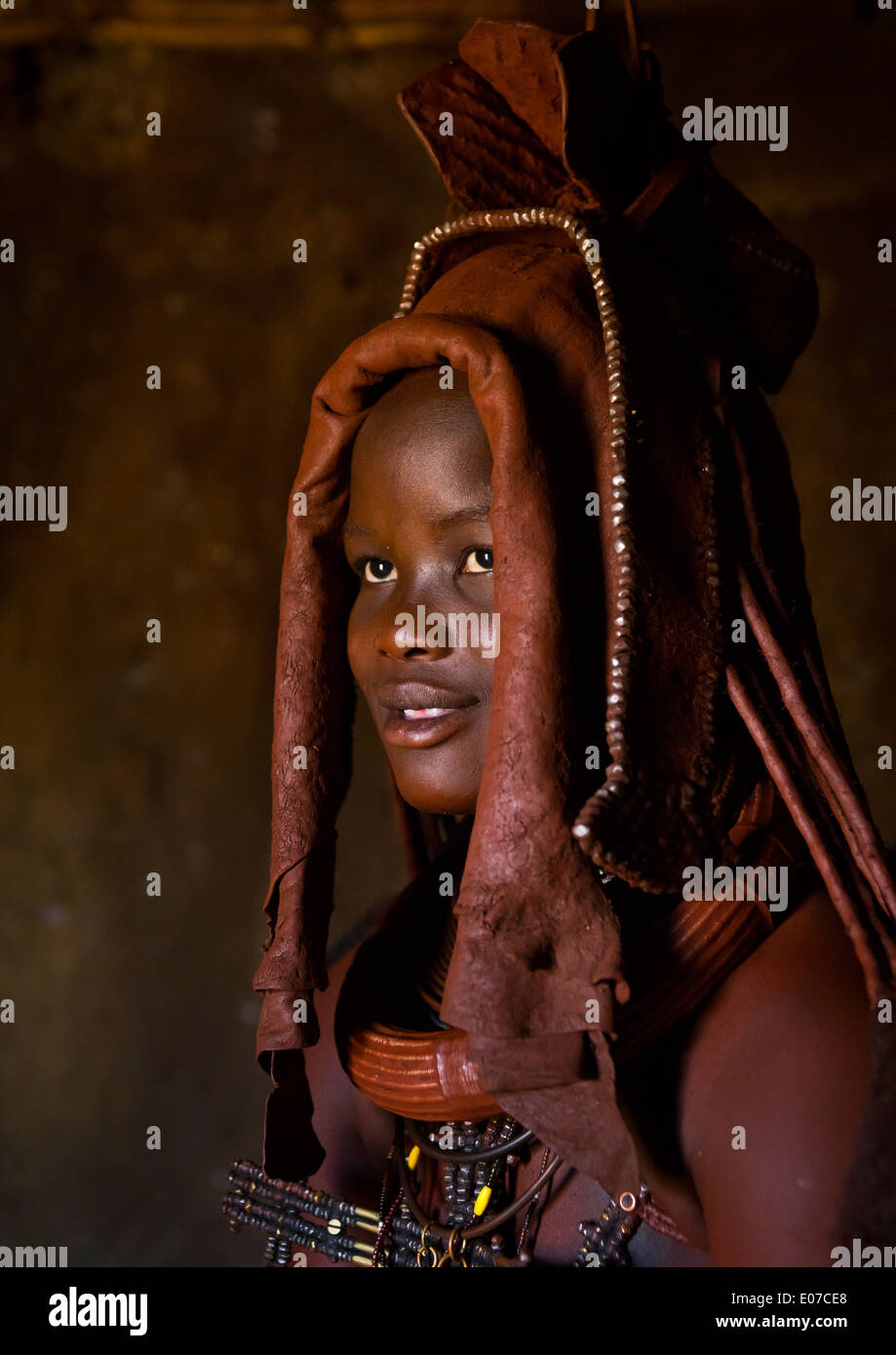 woman-wearing-wedding-headdress-in-himba-tribe-epupa-namibia-stock