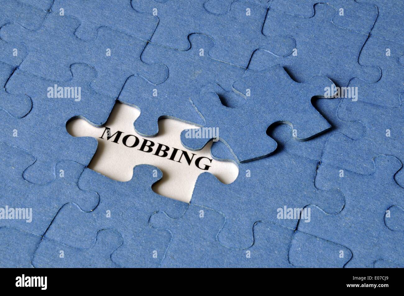 Illustration - The word 'Mobbing' is read under a missing piece of a jigsaw puzzle in Germany, 27 April 2011. Fotoarchiv für ZeitgeschichteS. Steinach - NO WIRE SERVICE Stock Photo