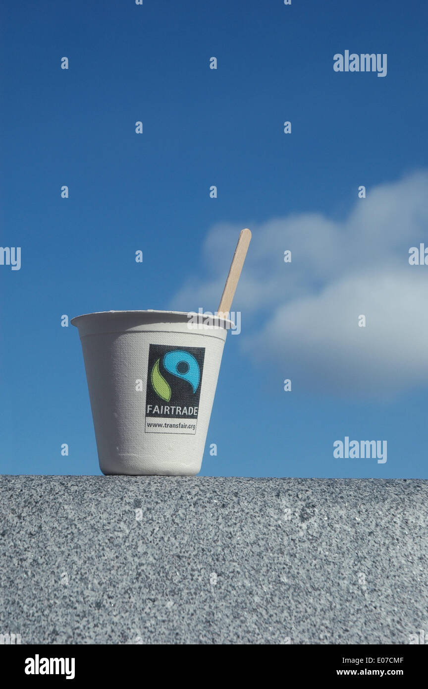 Illustration - A coffee cardboard cup with the fairtrade logo in front of a blue sky in Germany, 26 September 2009. Fotoarchiv für Zeitgeschichte ATTENTION! NO WIRE SERVICE Stock Photo