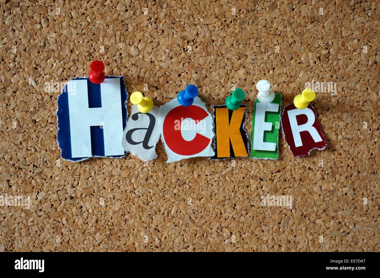 Illustration - The word 'Hacker' made of cut-out newspaper letters hangs on a bulletin board, 22 November 2013. Photo: Berliner Verlag/Steinach - NO WIRE SERVICE Stock Photo