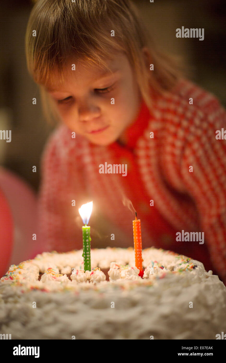 Birthday girl blowing out candles hires stock photography and images