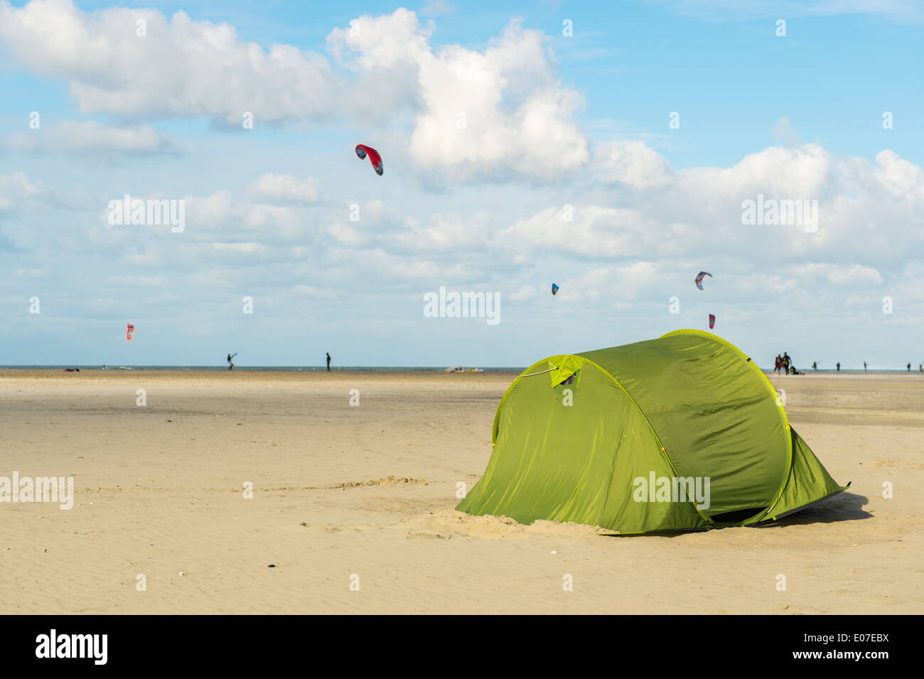 tent at the beach with kite surfers in the background Stock Photo Alamy