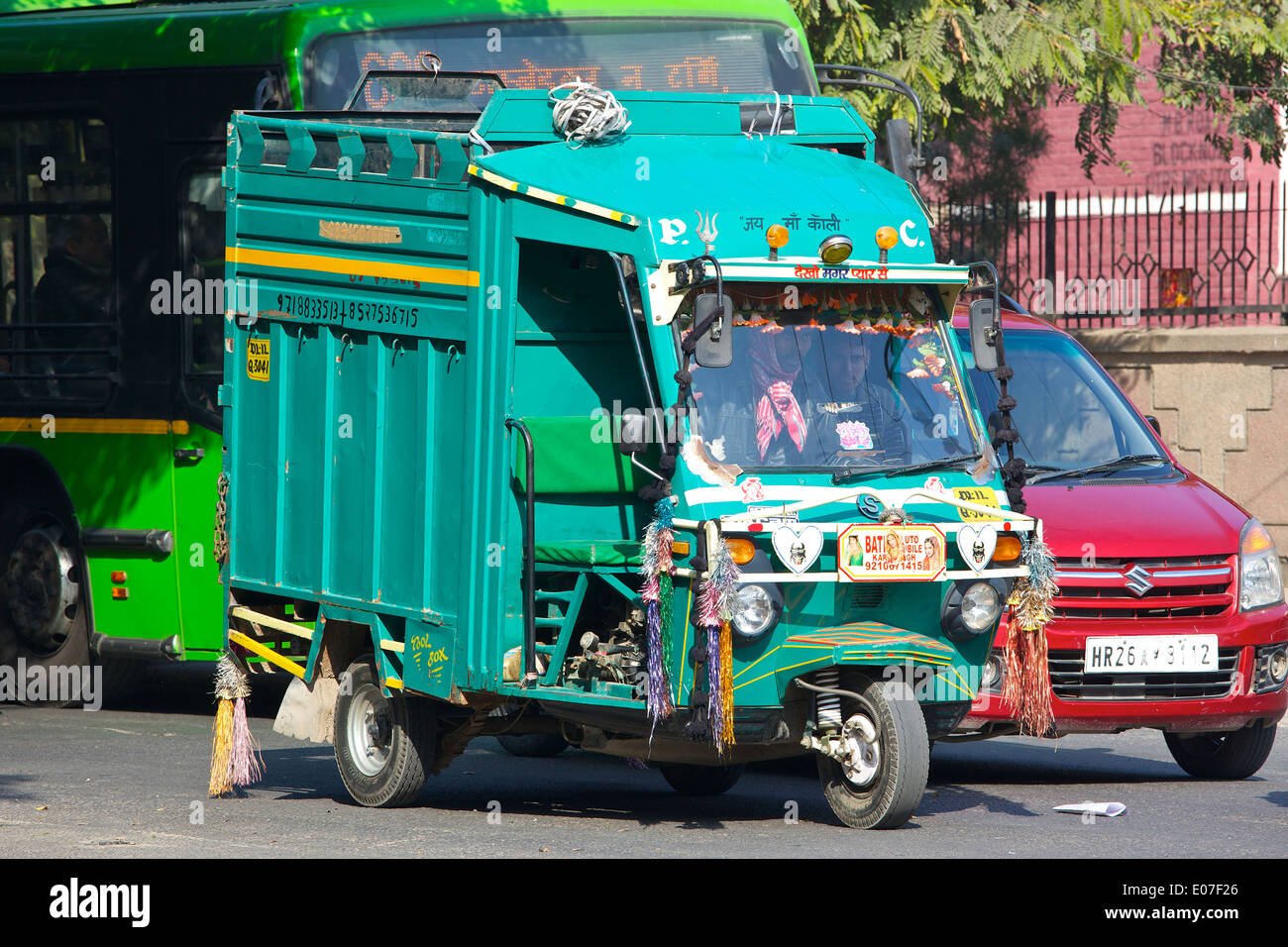 A brightly coloured Indian Dustbin Lorry, (Garbage Truck), waits at the