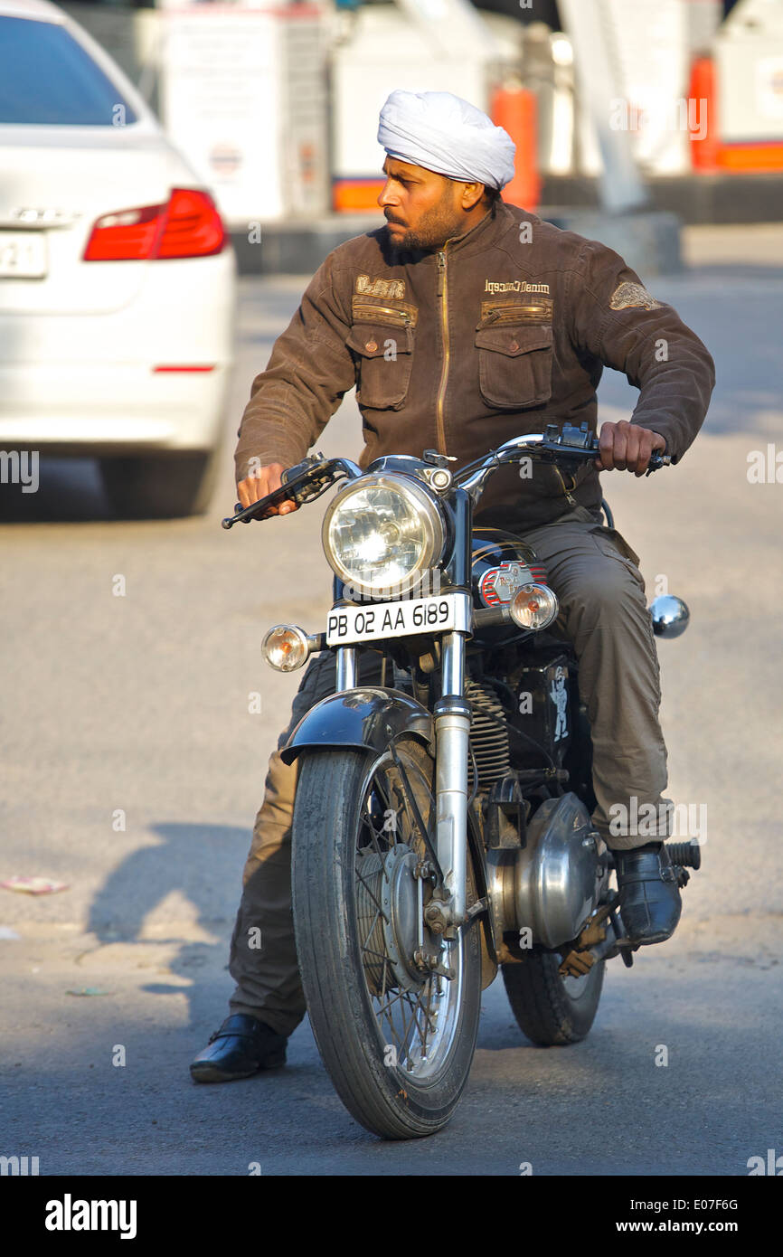 Waiting for the Traffic, A Sikh Motorcyclist Waiting For The Green Light In New Delhi, India. Stock Photo