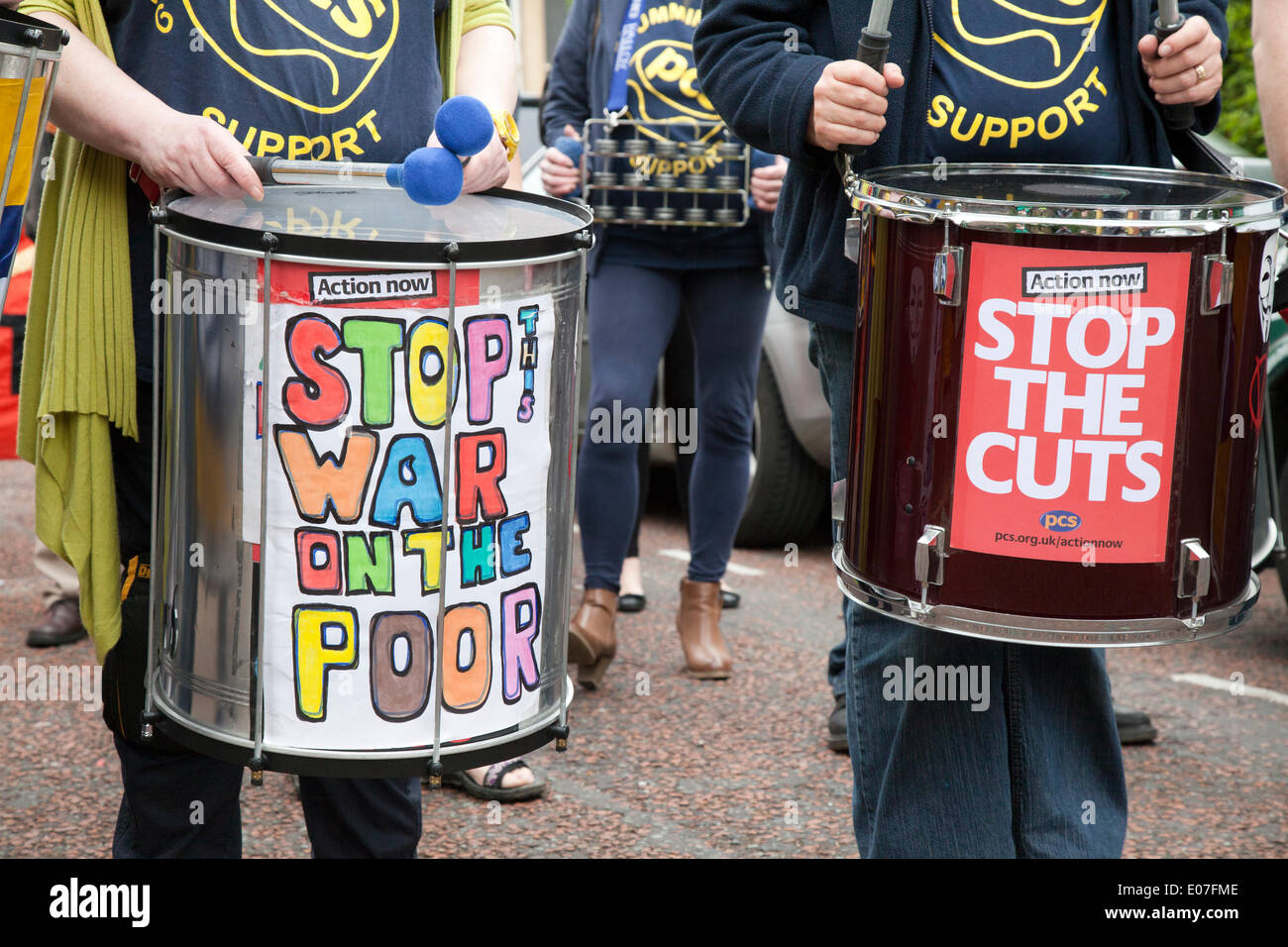 'Stop the War on the Poor'  PCS drumming up support at Salford's annual May Day Rally.  Manchester, Salford, Bury and Oldham Trades Union Councils organized this year's May Day event, with the message `A Better Drumming up support PCS. Future for All Our Communities' to celebrate international workers day. Workers gathered at Bexley Square to hear speakers prior to marching to Cathedral Gardens. The themes this year included opposition to cuts, the Bedroom Tax and fracking. Stock Photo
