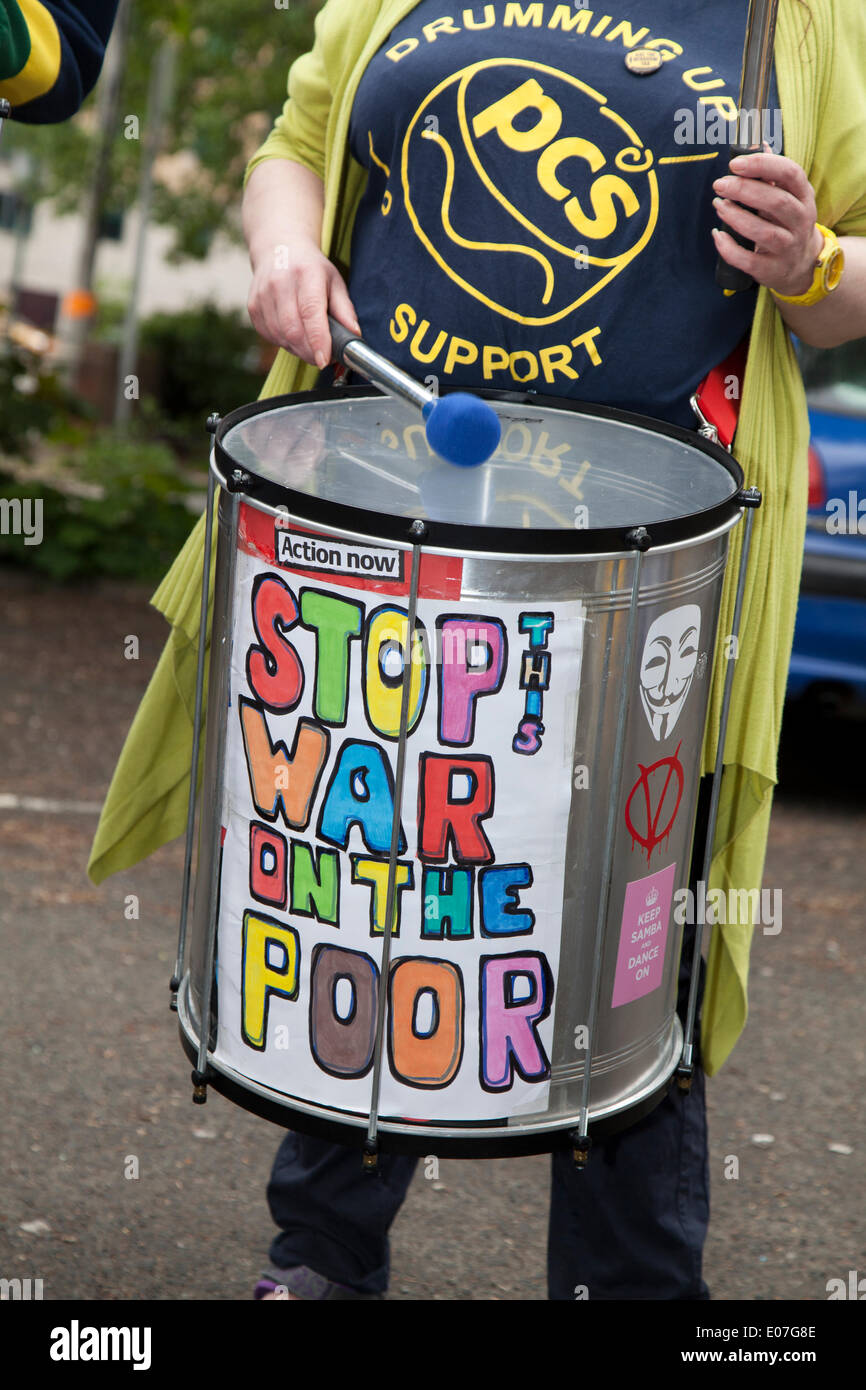 'Stop the War on the Poor'  PCS drumming up support at Salford's annual May Day Rally.  Manchester, Salford, Bury and Oldham Trades Union Councils organized this year's May Day event, with the message `A Better Drumming up support PCS. Future for All Our Communities' to celebrate international workers day. Workers gathered at Bexley Square to hear speakers prior to marching to Cathedral Gardens. The themes this year included opposition to cuts, the Bedroom Tax and fracking. Stock Photo