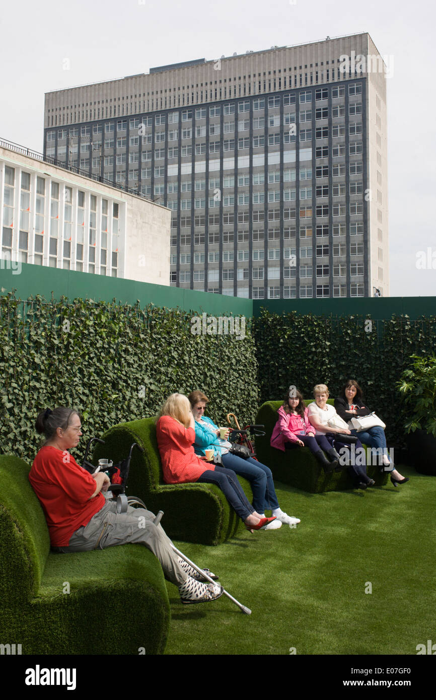 Shoppers enjoy the new John Lewis open air roof garden above their