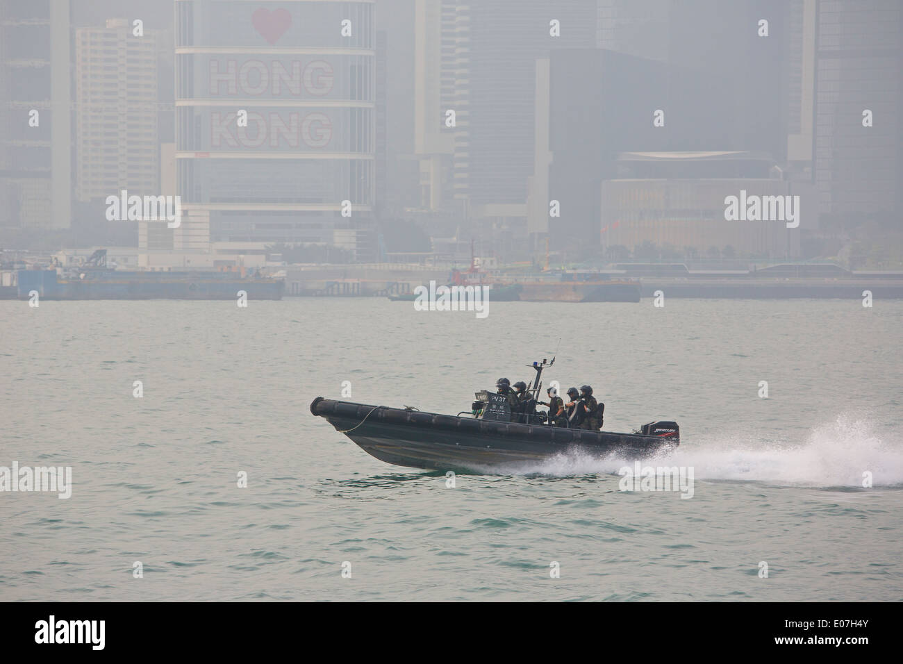 Hong Kong Police Boat speeding along Victoria Harbour, Hong Kong. Stock Photo