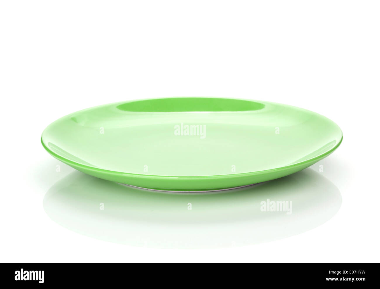 Green empty plate. Isolated on white background Stock Photo - Alamy