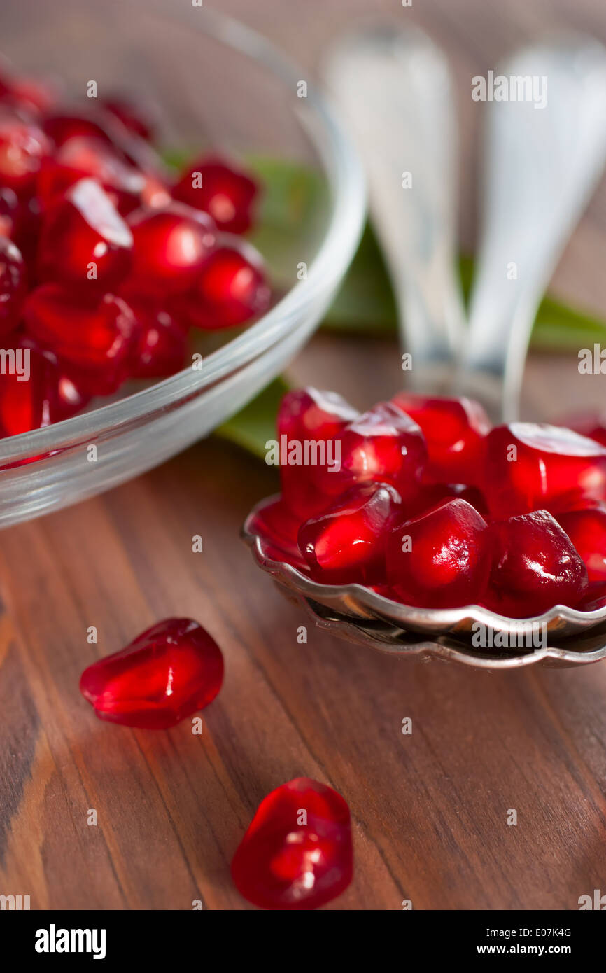 Fresh pomegranate seeds in a spoon. Stock Photo
