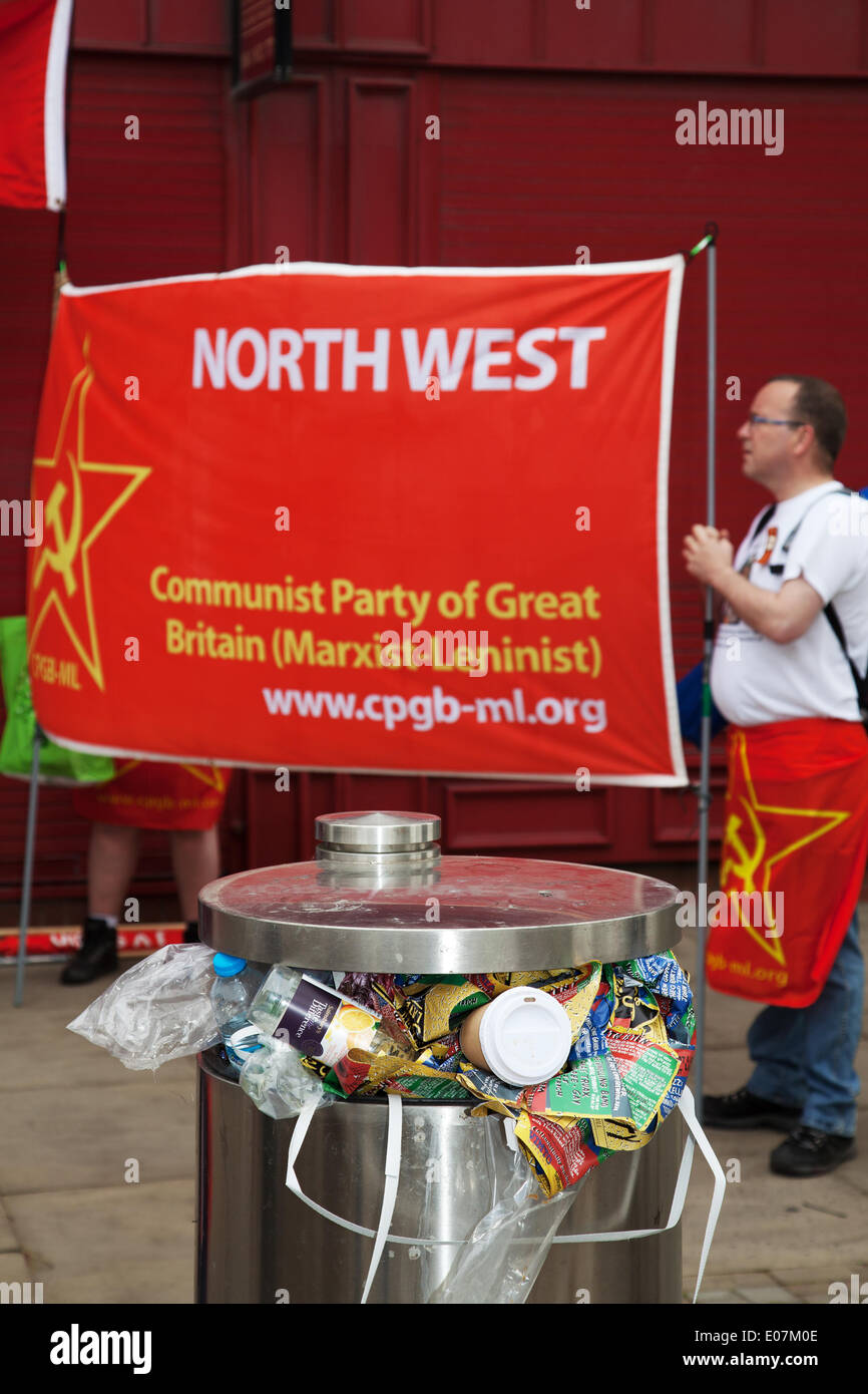 Salford, Manchester, UK  5th May, 2014. Full rubbish bins and North-west Communist party of  Great Britain at Salford's annual May Day Rally Manchester, Salford, Bury and Oldham Trades Union Councils organized this year’s May Day event in Manchester, with the message `A Better Future for All Our Communities' to celebrate international workers day. Workers gathered at Bexley Square to hear speakers prior to marching to Cathedral Gardens. The themes this year included opposition to cuts, the Bedroom Tax and fracking. Stock Photo