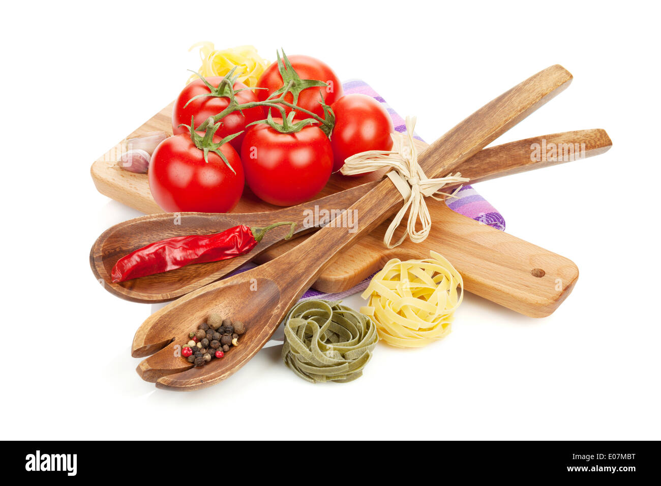 Pasta, tomatoes and spices. Isolated on white background Stock Photo