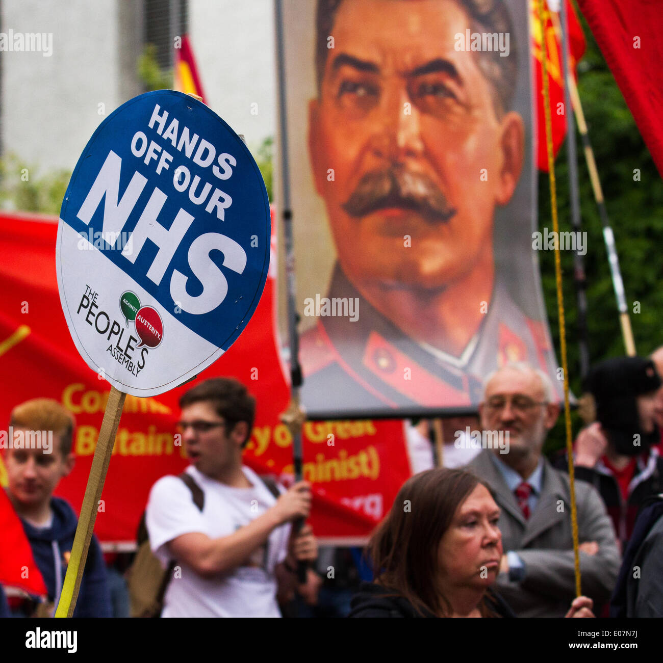 'Hands of our NHS' poster,  picture poster of Stalin, Russia, communism, and Russian general banner at Salford's annual May Day Rally. Trades Union Councils organized this year’s May Day event in Manchester, with the message `A Better Future for All Our Communities' to celebrate international workers day. Stock Photo