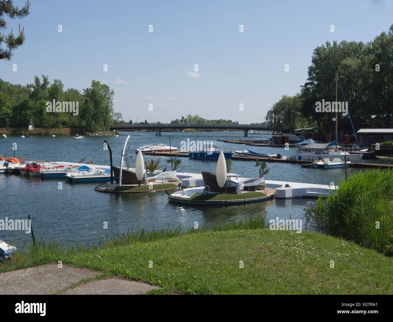 Alte Donau, or Old Danube,in Vienna Austria a lake for swimming, boating, relaxation and refreshments, boats for hire Stock Photo