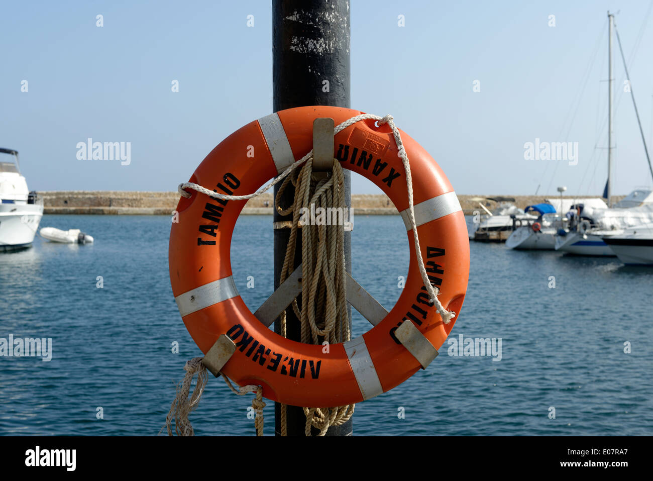 Lifesaving ring buoy on waterfront Venetian harbour Chania Town Crete ...