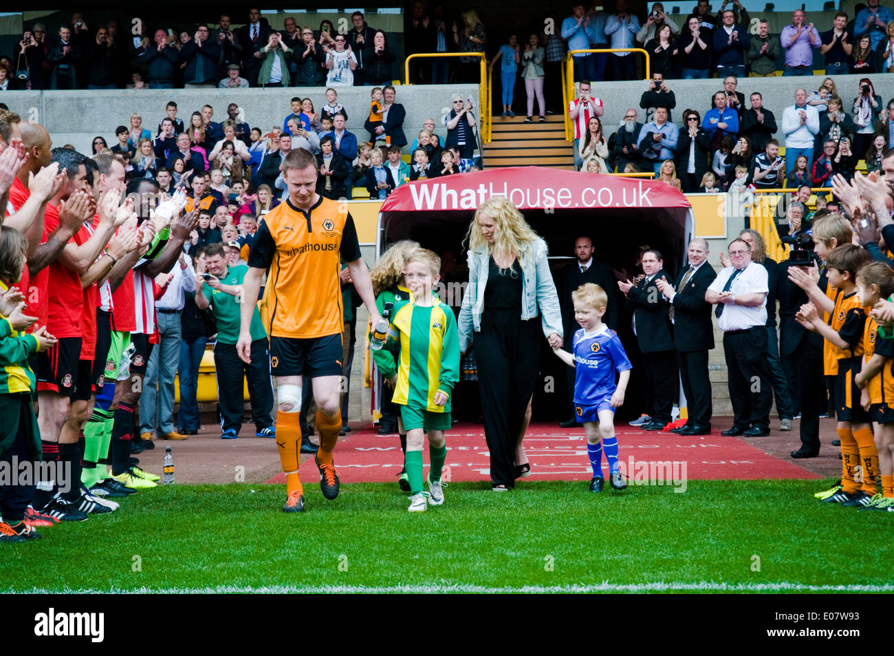 Wolverhampton, UK. 5th May, 2014.  Jody Craddock walks out to a guard of honour with his family for his testimonial to celebrate 10 years at Wolverhampton Wanderers Wolverhampton Wanders played against former players of his former club Sunderland, raising money for the Birmingham Children's Hospital. The Sunderland side included Niall Quinn and Kevin Phillips.  Credit:  Paul Swinney/Alamy Live News Stock Photo