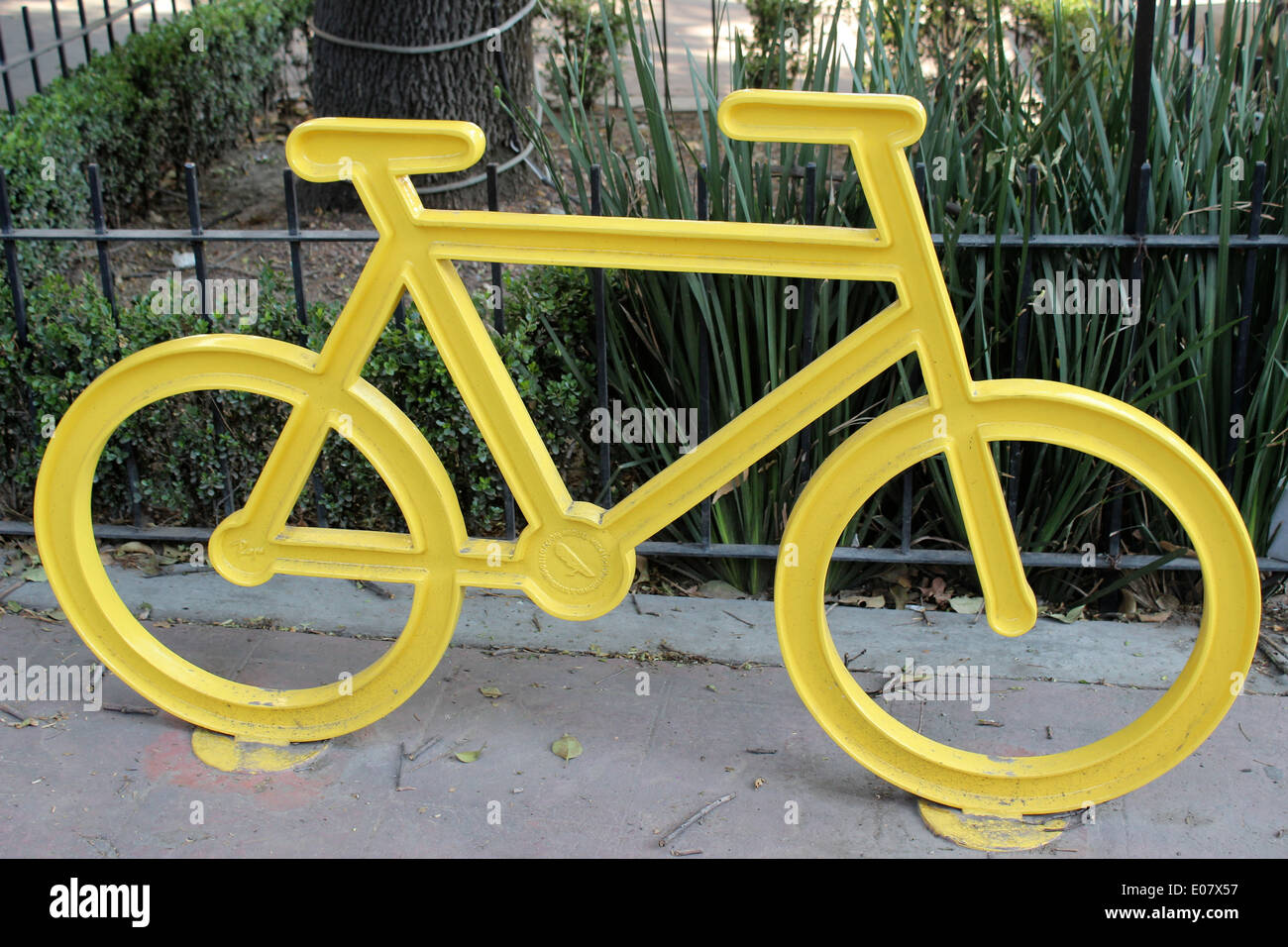 Yellow metal bicycle stand in Polanco, Mexico City Stock Photo