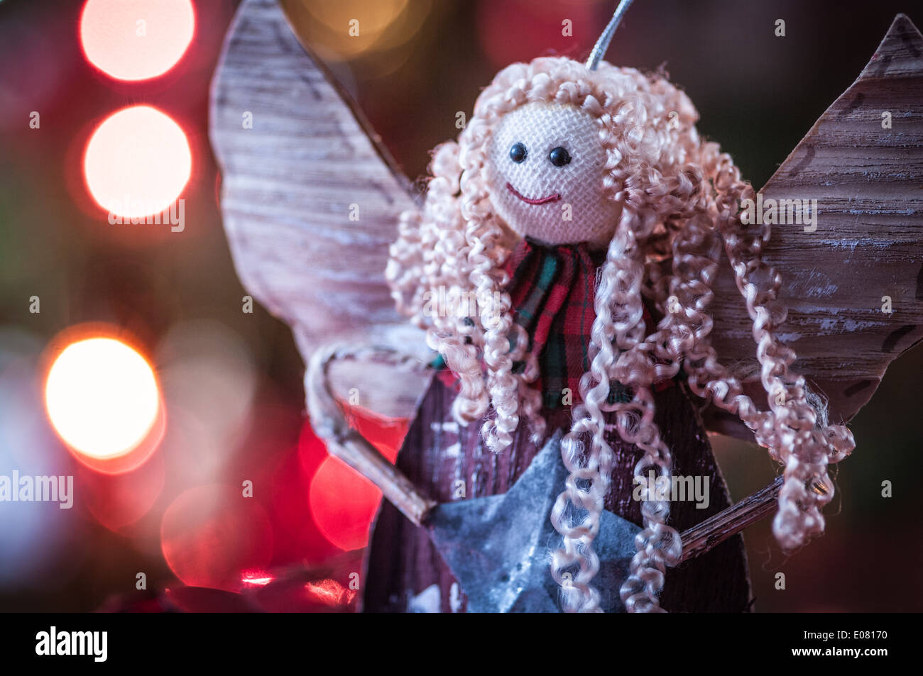 Hand made Christmas angel decoration hanging on a tree Stock Photo