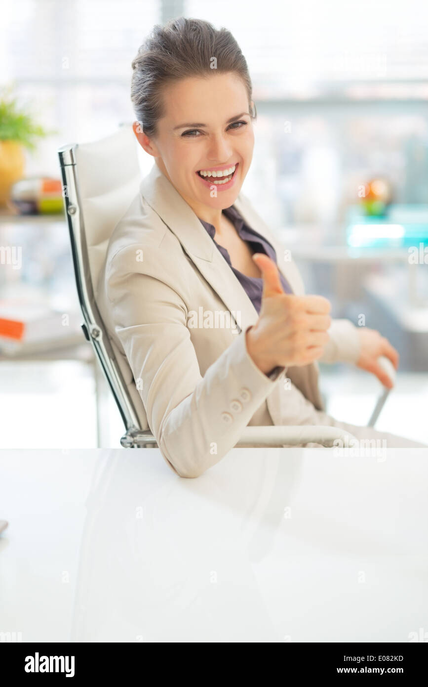 Happy business woman showing thumbs up Stock Photo - Alamy