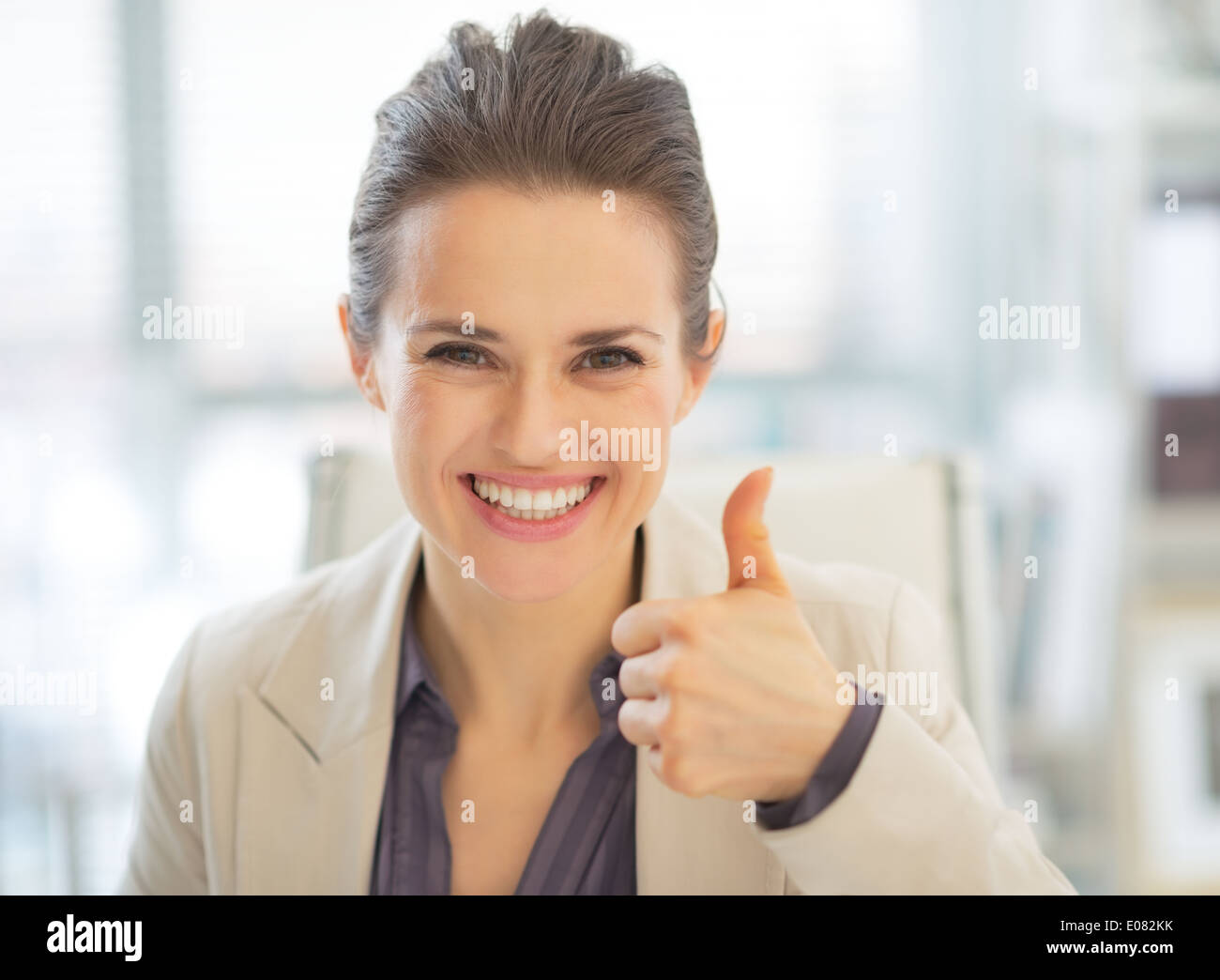 Portrait of happy business woman showing thumbs up Stock Photo - Alamy