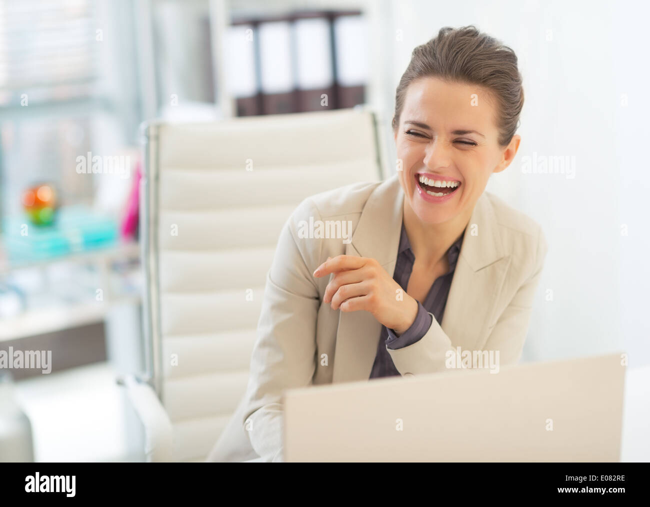 Laughing business woman hi-res stock photography and images - Alamy