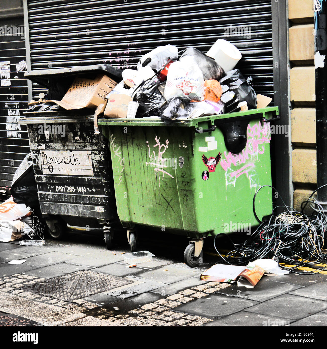 https://c8.alamy.com/comp/E0844J/creative-image-of-over-flowing-coming-refuse-bins-destined-for-recycling-E0844J.jpg