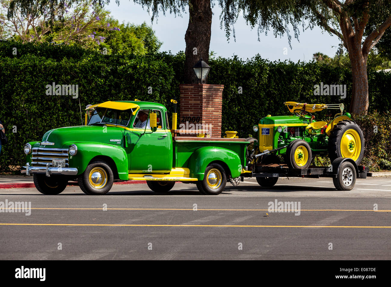A 1950's Chevy Truck with matching John Deere Tractor Stock Photo