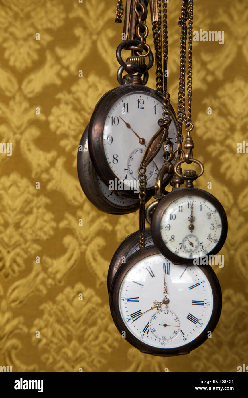 Old antique pocket watches with old antique background pattern Stock Photo