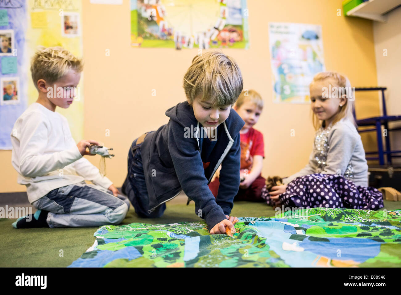 Elementary students playing in kindergarten Stock Photo