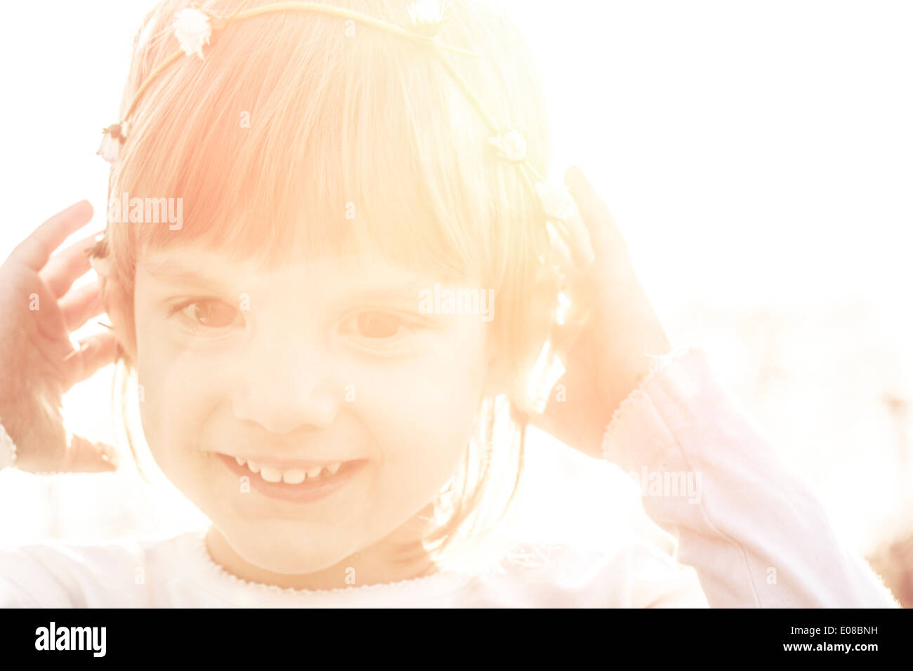 Little girl with flowers in hair Stock Photo - Alamy