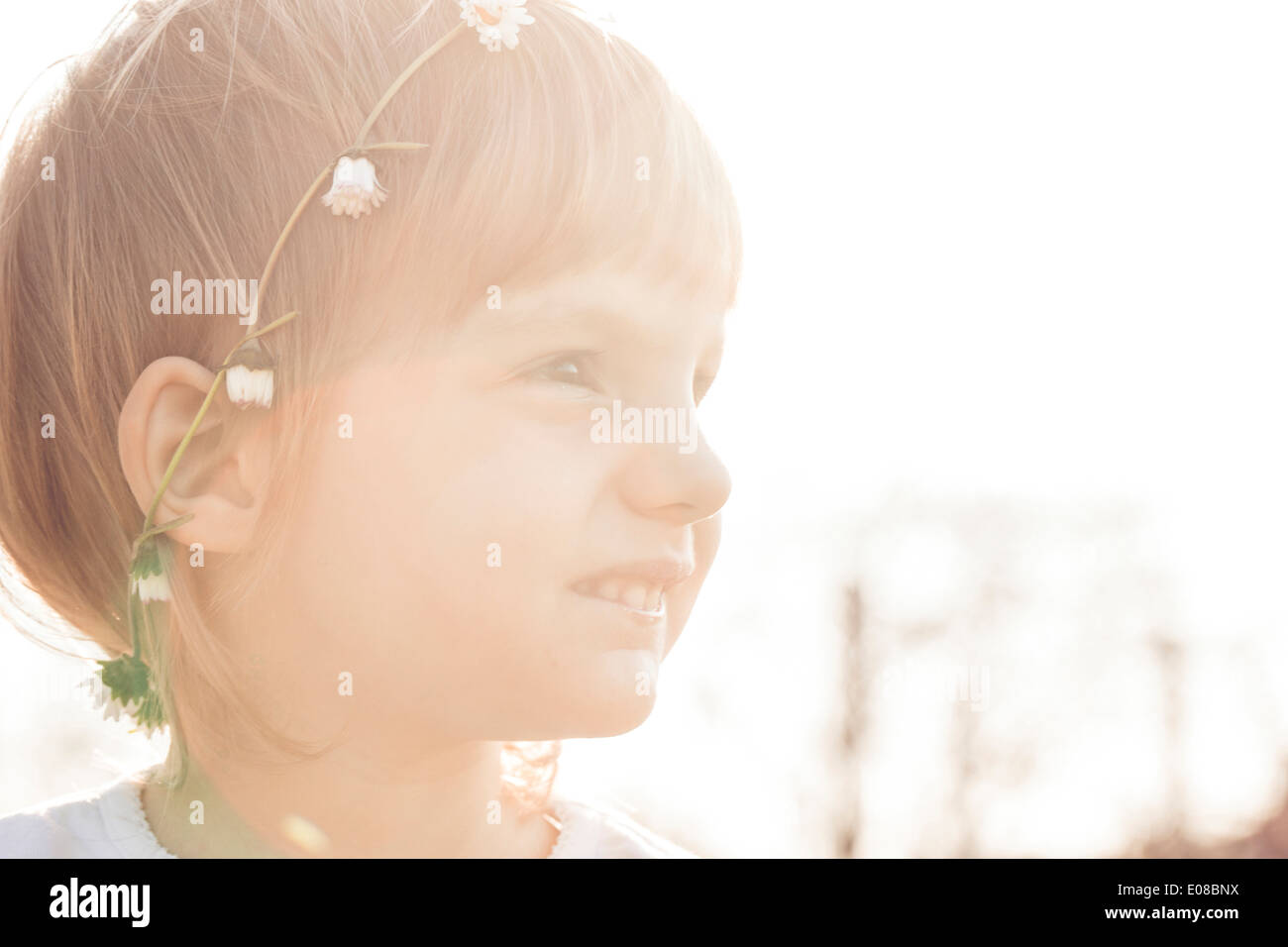 Little girl with flowers in hair Stock Photo