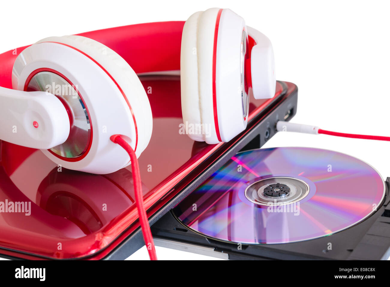 Red headphones and laptop with compact disk for language course learning Stock Photo